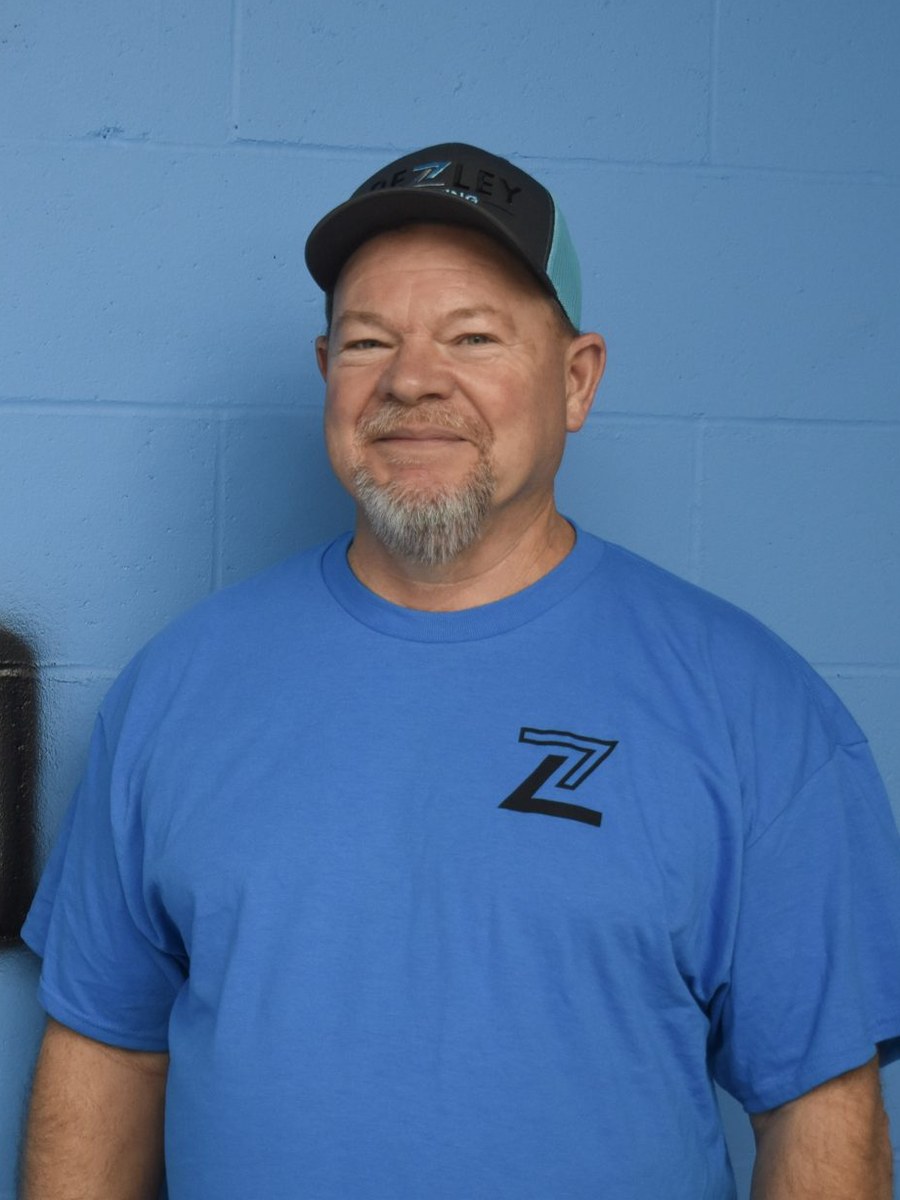 Pezley Painting team member in branded apparel